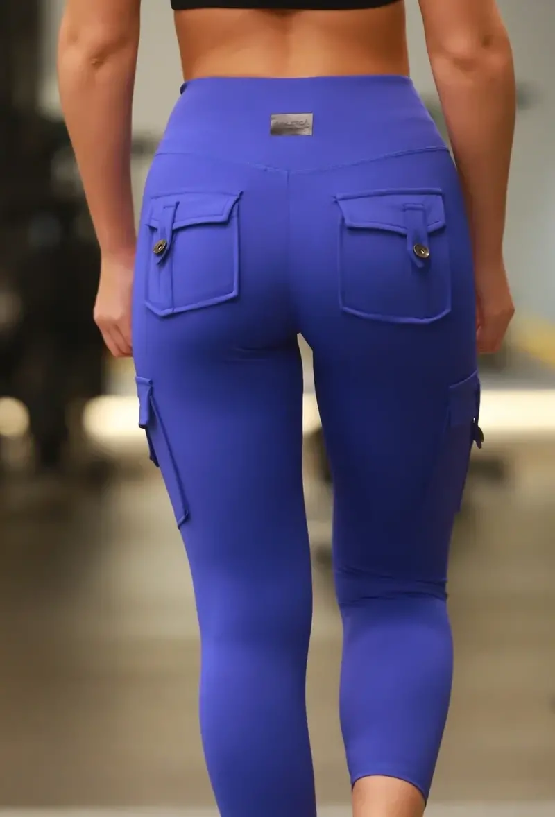 A close-up view of blue Athletica Athleisure leggings featuring functional pockets for an active lifestyle