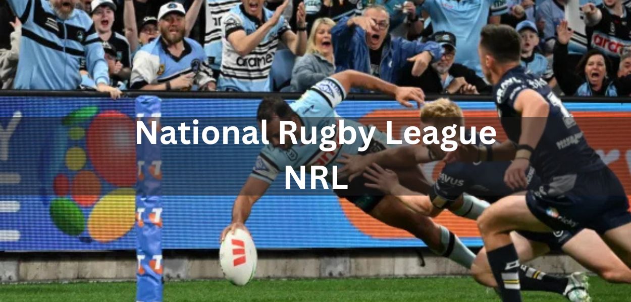 "An NRL player diving to score a try near the corner post during an intense match, with enthusiastic fans cheering in the background."