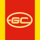 "The official Gold Coast Suns AFL logo featuring bold ‘GC’ initials within an oval on a vibrant red and yellow background, symbolising the team’s energy and spirit."