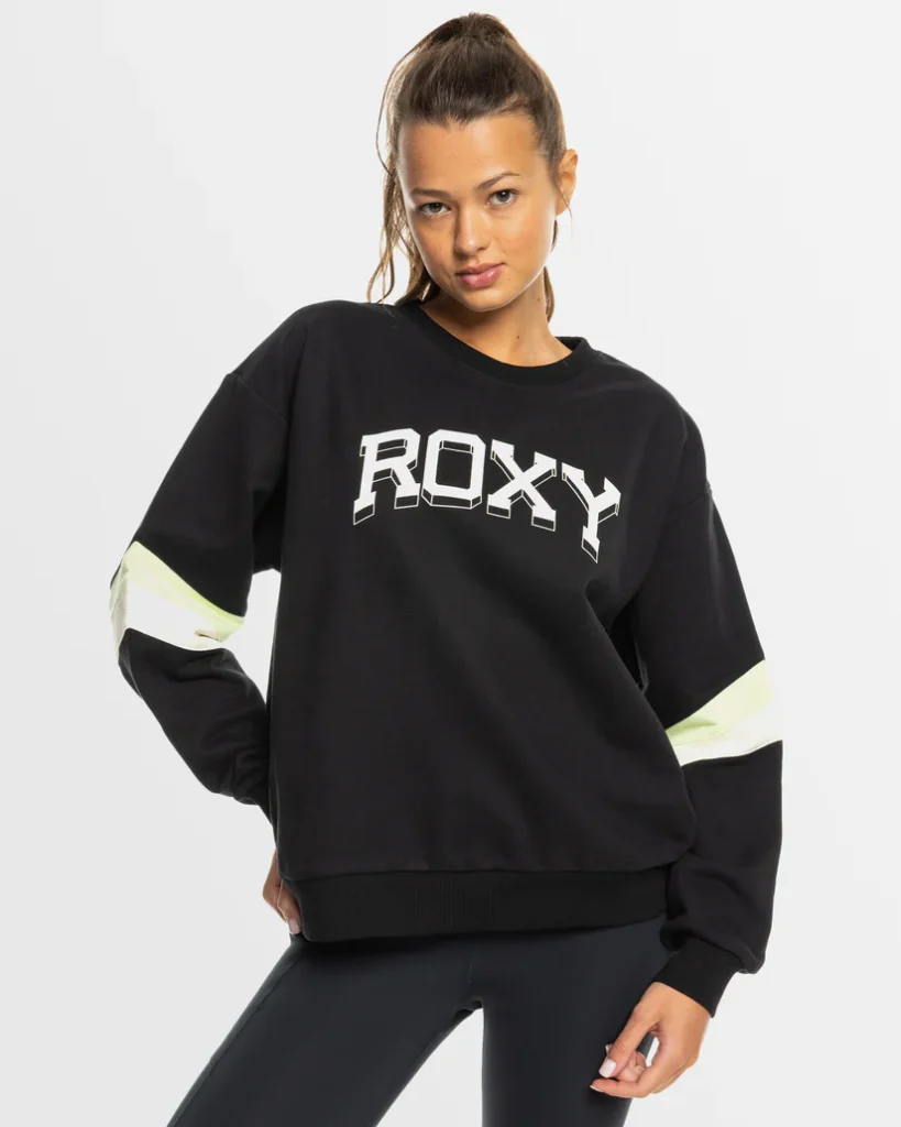 Roxy women's black sweatshirt with bold logo and striped sleeve design, showcasing sporty and casual style. Explore Roxy's complete women's clothing range at www.waiteandsea.com.au.