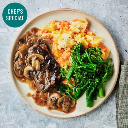 Braised Beef Steak with Broccolini and Mashed Vegetables: A hearty Chef's Special meal for health and fitness.
