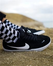 Nike SB shoes in action, styled with checkered socks, embodying health and fitness versatility.