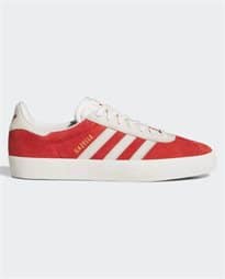 Side profile of Adidas Gazelle shoe in red and white, blending health and fitness with everyday fashion.