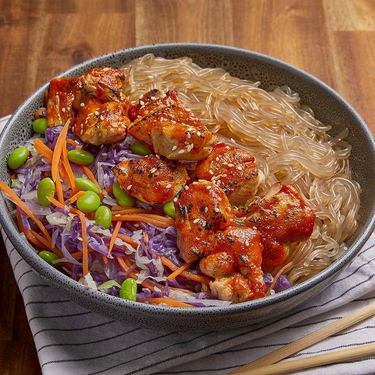 Baked Korean chili chicken served with glass noodles and fresh vegetables for Health and Fitness.