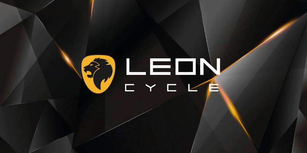 Leon Cycle logo with a sleek black geometric background, featuring a gold lion crest. Ideal for health and fitness enthusiasts exploring high-quality e-bikes. Visit www.waiteandsea.com.au for more details.