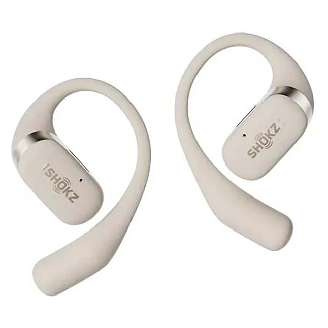 A pair of beige Shokz OpenFit bone conduction earbuds, designed for health and fitness enthusiasts. Wireless, sweat-resistant, and comfortable for all-day wear. Available at www.waiteandsea.com.au.