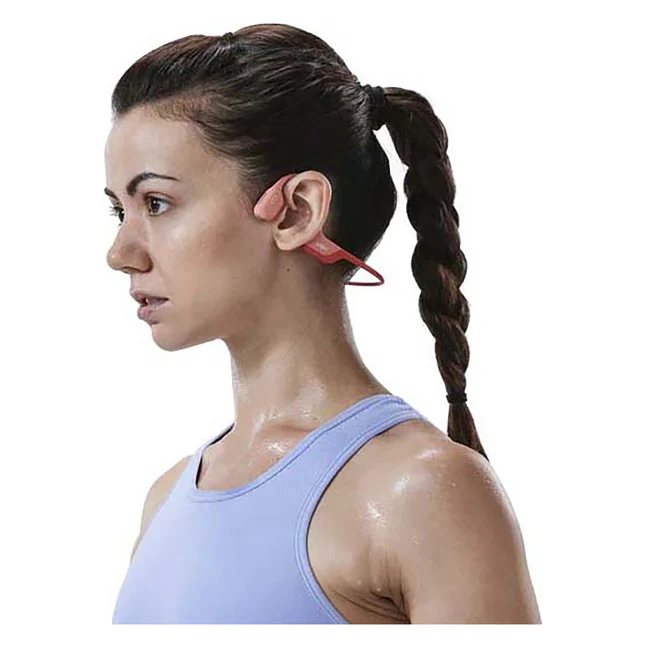 A woman wearing Shokz OpenRun bone conduction headphones in red while exercising. Designed for health and fitness enthusiasts, these lightweight, sweat-resistant headphones provide premium audio while keeping you aware of your surroundings. Available at www.waiteandsea.com.au.